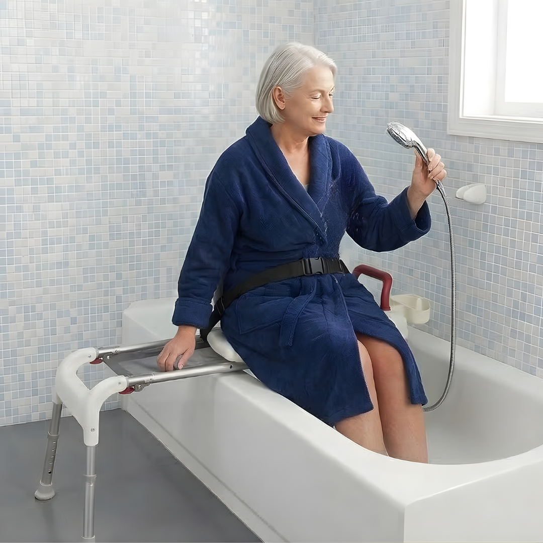 Person using a handheld shower while seated on a Drive Medical sliding transfer bench